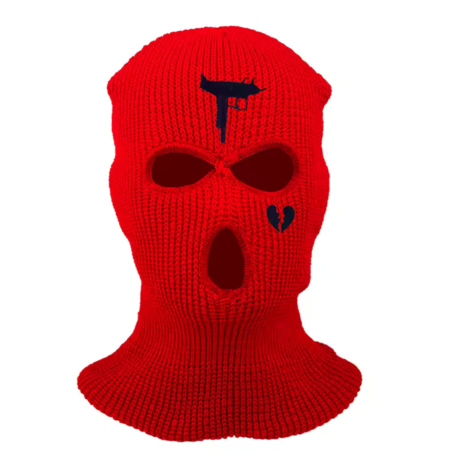 Red knitted balaclava with black logo on a white background